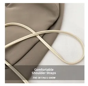 Detailed close-up of comfortable cream faux leather shoulder strap with neat stitching