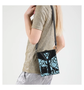 Detail of creative suit-style blue snake texture crossbody bag with tie and collar design
