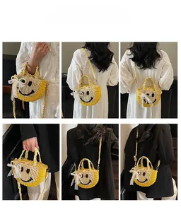 Detail view of woven straw bag featuring smiley face pattern and lace ribbon accents
