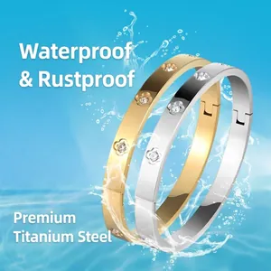 Classic titanium steel open bracelets in gold and silver with diamond flower motifs