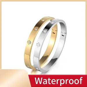 Moderne florale Armbänder aus Titanstahl in Gold und Silber mit Kristallen