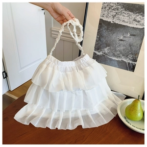 Close-up of white layered ruffle tote bag featuring sweet lace pleats and chiffon texture