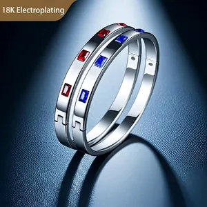 18K plated titanium steel bangles featuring minimalist red and blue inlaid gemstones