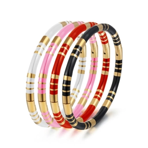 Set of four luxury enamel bracelets in white, pink, red, and black with gold stripe accents