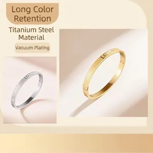 Titanium steel LOVE bangle with gold and silver finishes in matte and polished texture
