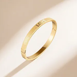 Retro gold stainless steel LOVE bracelet with matte and polished finish hinges