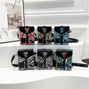 Minimalist box bags in suit and tie design with various snake and zebra patterns