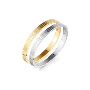 Polished stainless steel bangle with Greek meander pattern in gold and silver finish
