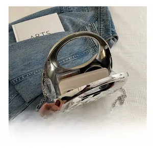 Silver mirror acrylic handbag interior capacity showing phone and makeup accessories