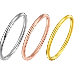 Minimalist stainless steel ring set in silver, gold, and rose gold with polished finish