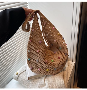 Close-up of bohemian crochet tote bag featuring colorful pearl beads and woven texture