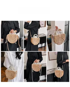 Detail view of handmade bamboo woven bag with faux pearl handles and long chain strap