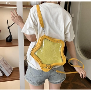 Bolso Ita amarillo en forma de estrella con ventana de PVC transparente y correa ajustable