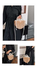 Detail of handmade semi-circular woven bamboo bag with white pearl handle and drawstring lining