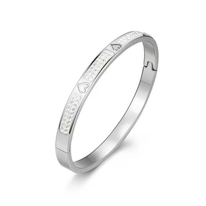 Close-up of titanium steel heart bangle with pavé crystals and hidden hinge clasp