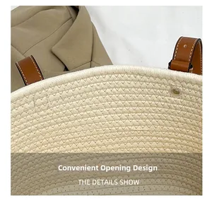 Macro detail of beige woven tote bag showing leather handle and convenient open top