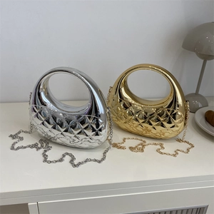 Chic quilted metallic acrylic handbag in gold and silver with chain shoulder strap