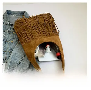 Spacious brown suede hobo bag with vintage fringe details shown with large capacity
