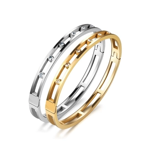 Women's cutout geometric bangles in gold and silver finish with inlaid cubic zirconia