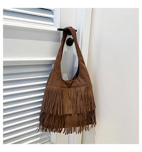 Detailed view of brown frosted suede hobo bag featuring stylish long double-layer fringes