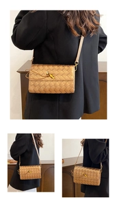 Detail view of a woven metallic crossbody bag with elegant knot buckle and slim strap