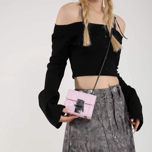 Pink quilted mini chain crossbody bag with black metallic lock and sleek diamond pattern