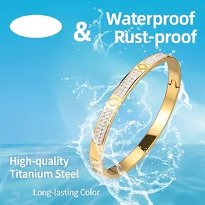 Waterproof stainless steel clover bracelet with double row diamonds on ocean background