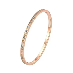 Detailed macro view of rose gold plated bracelet with sparkling zircon stones
