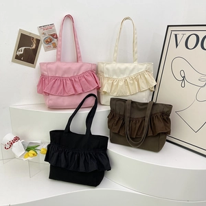 Minimalist canvas tote bags with ruffle trim in pink, white, brown, and black colors