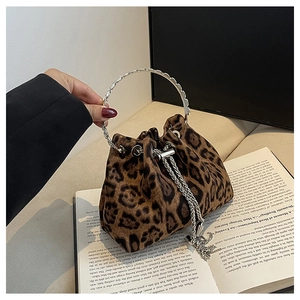 Leopard print bucket bag with silver metal ring handle and chain tassel detail
