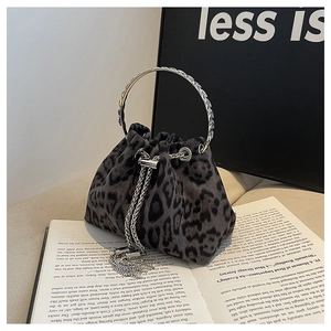 Detail of leopard print bucket bag with silver metal handle and chain drawstring