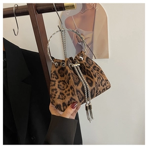 Detail of leopard print bucket bag with silver ring handle and chain tassel drawstring