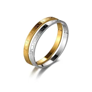 Men's stainless steel bangle set with Greek key pattern in gold and silver finish