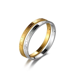 Minimalist stainless steel cuff bracelets with Greek meander patterns in gold and silver