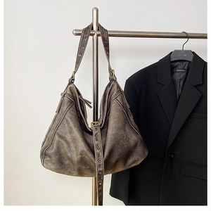 Detailed view of washed vintage PU leather tote with adjustable strap and side zipper