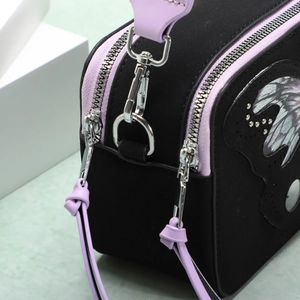 Retro camera-style crossbody bag with butterfly patches and purple leather tassels