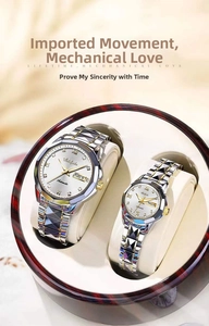 Macro shot of two-tone stainless steel watches with dual calendar display in a gift box