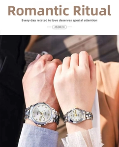 Close-up of couple's hands wearing steel watches with dual calendar and white dial
