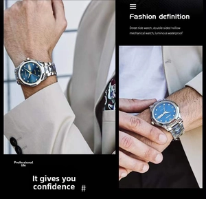Close-up of blue sunray dial watch with Roman numerals on a man's wrist in suit
