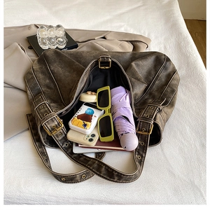 Top view of large brown vintage tote bag showing spacious interior with daily essentials