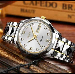 Detail of luxury two-tone steel watch featuring a white dial and roman numeral markers