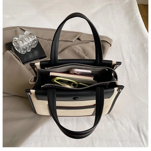 Detail view of large contrast canvas tote bag showing spacious double zipper interior