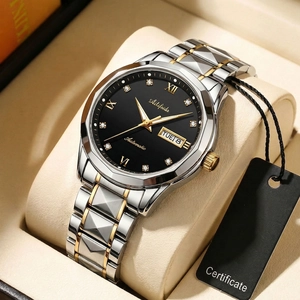 Detail of luxury two-tone steel watch with black dial and Roman numeral crystal markers