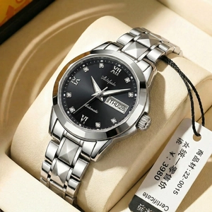 Macro detail of men's automatic watch with black dial and stainless steel butterfly buckle