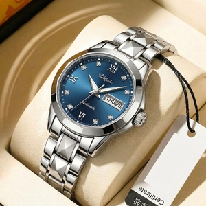 Macro shot of business quartz watch with blue sunray dial and day-date display