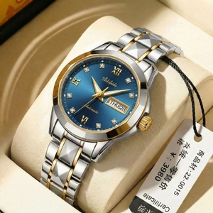 Detailed view of women's two-tone quartz watch with blue sunray dial and diamond markers