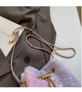 Detail of plush bucket bag featuring purple-pink gradient fur and star sequins