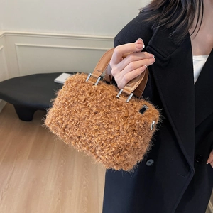 Brown fuzzy plush Boston bag with leather handles and silver hardware for women
