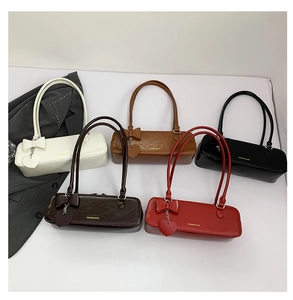 Multi-color vintage baguette underarm bags with bow and heart charms in a group display