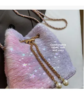 Detail of pink-purple plush bucket bag with sparkling star sequins and pearl charms
